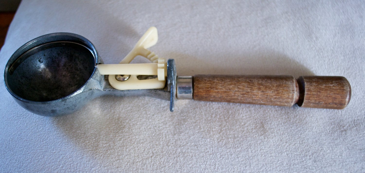 Vintage ice cream scoop with plastic gears and a nicely turned hardwood