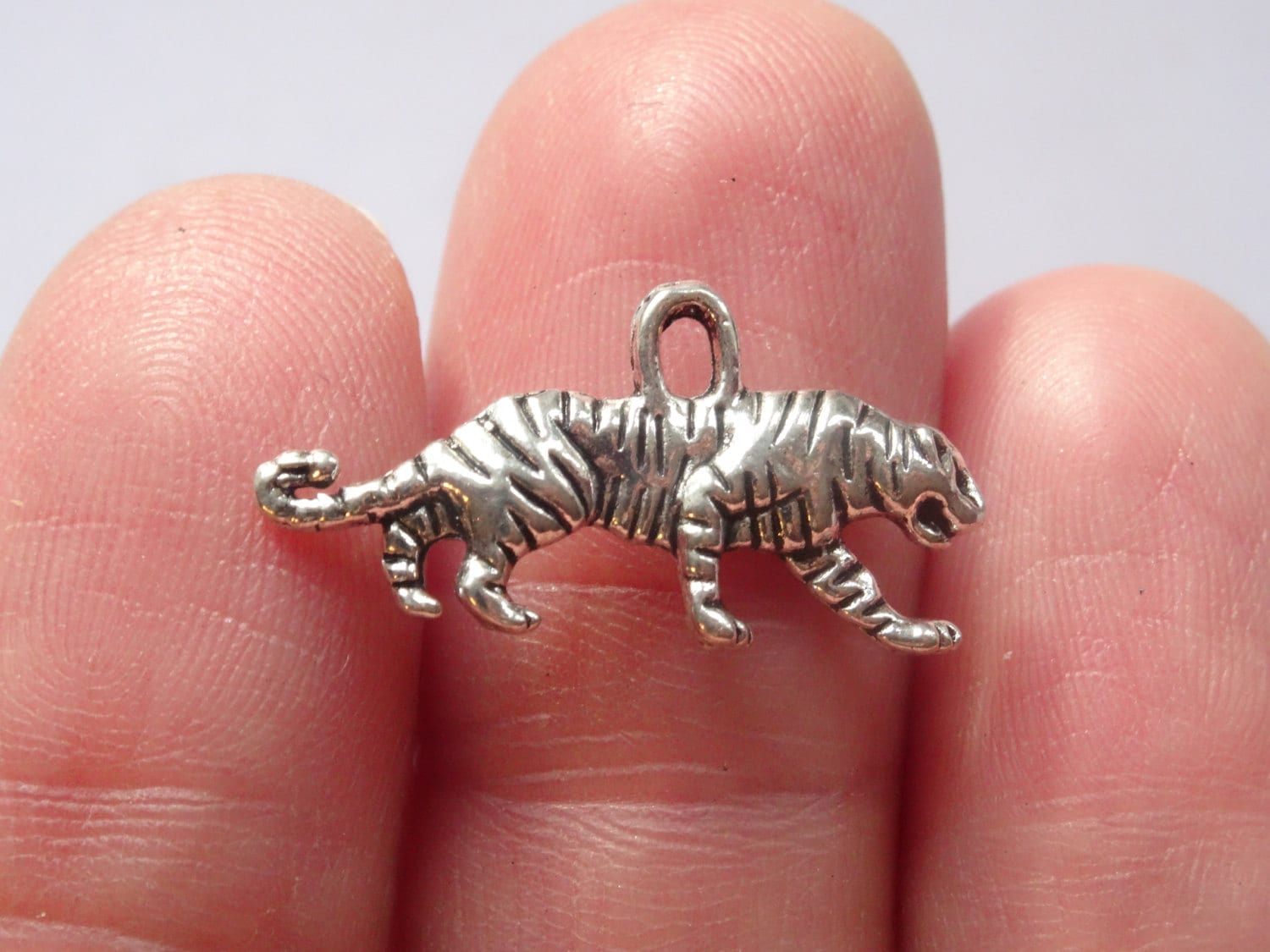 10 Tiger Charms Antique Silver 2mm x 1mm SC196