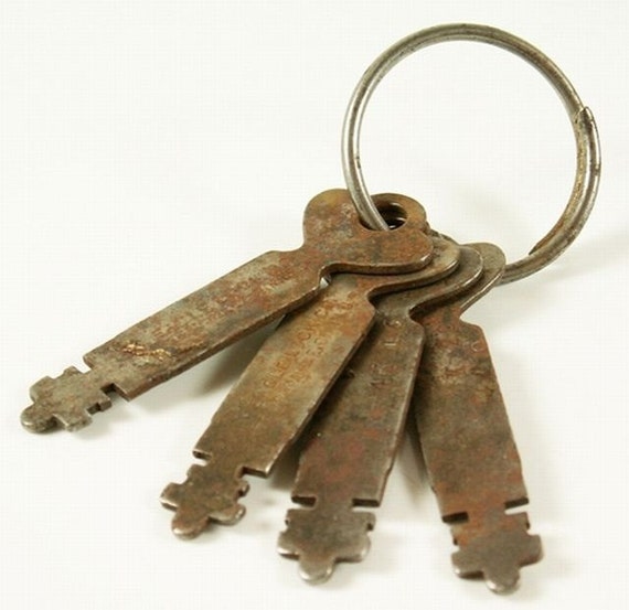 Collection of four matching antique flat keys used for