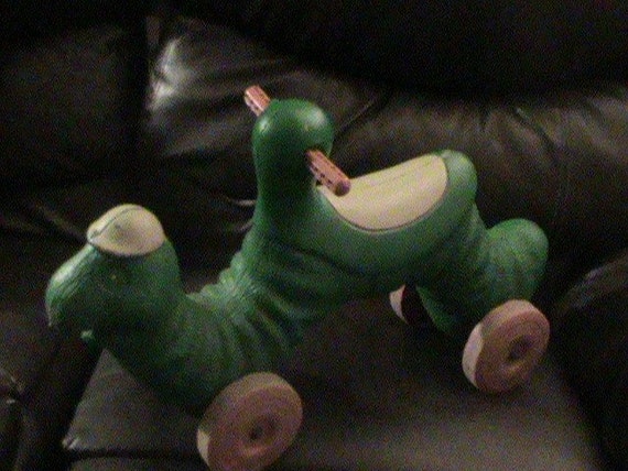 green inchworm ride on toy