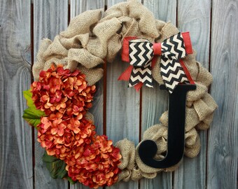Beautiful custom monogram, orange & black fall burlap wreath