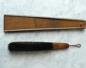 Vintage shoes shine brush. brown wooden hanging shoe brush