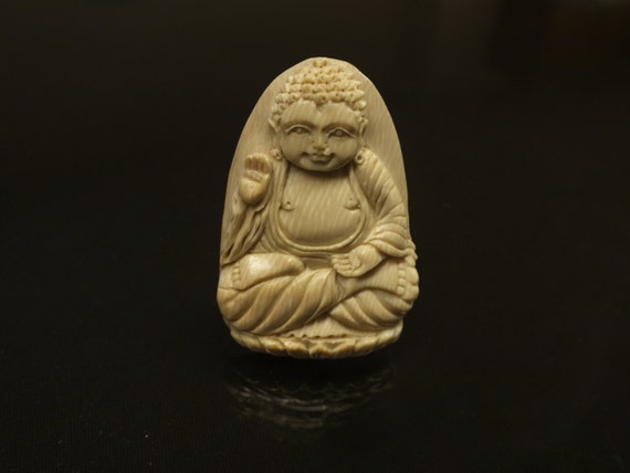 Bone carved buddha