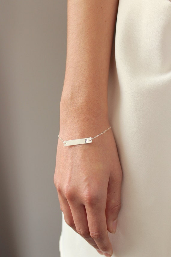 Silver bar initial bracelet (model photo)