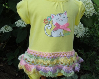 size 12 mos Short sleeve yellow onesie dress with added hand crocheted lace skirt in soft pastels. So cute kitten screen with pink bow.