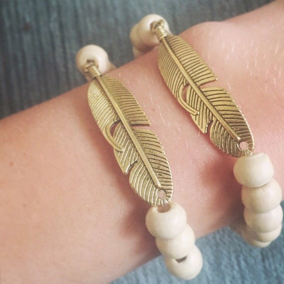 Items similar to Wooden beaded feather bracelet on Etsy