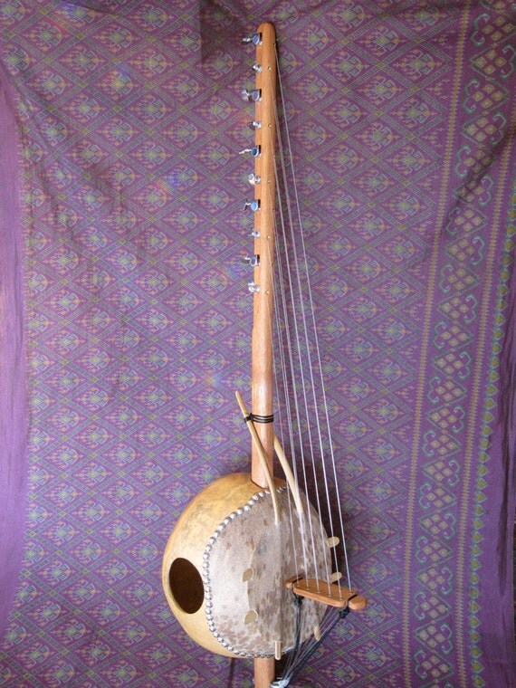 Items similar to This instrument is called a Kamale Ngoni and is a 10 string harplike