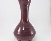 red flower vase or bottle