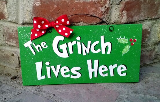 Christmas Decor Sign with glitter. "The Grinch Lives Here".