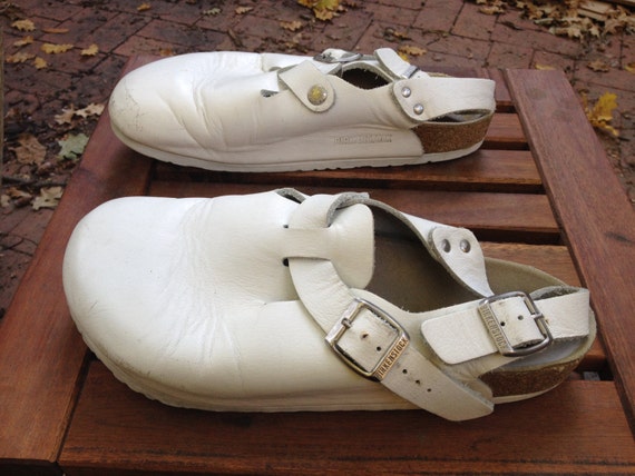 white birkenstocks with black bottom