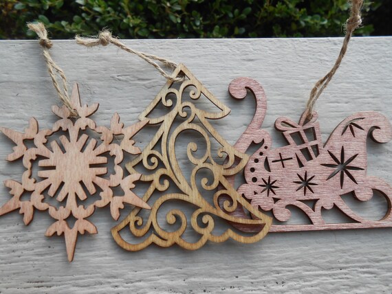 set of three wood ornaments laser cut snowflake tree set of three wood ornaments laser cut snowflake tree