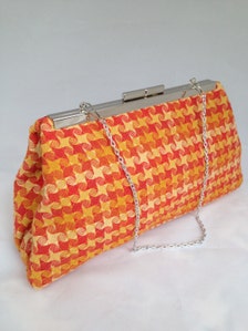 orange and gold clutch bag