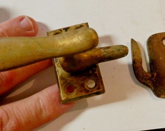 a solid cast brass window latche and keeper vintage