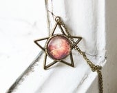 GALAXY // Pendant in the form of a star of metal brass with the image of Space under glass // Space, World // Pink, Red, Orange // Fashion