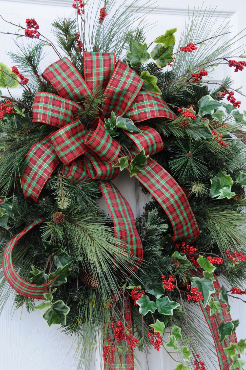 Christmas wreath with long needle pine ivy and plaid bow