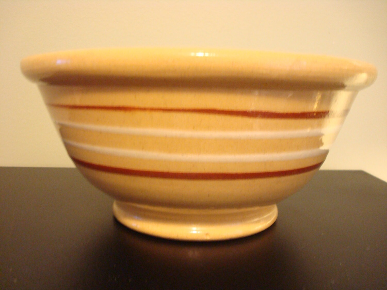 Sweet vintage yellow ware bowl with brown and white stripes