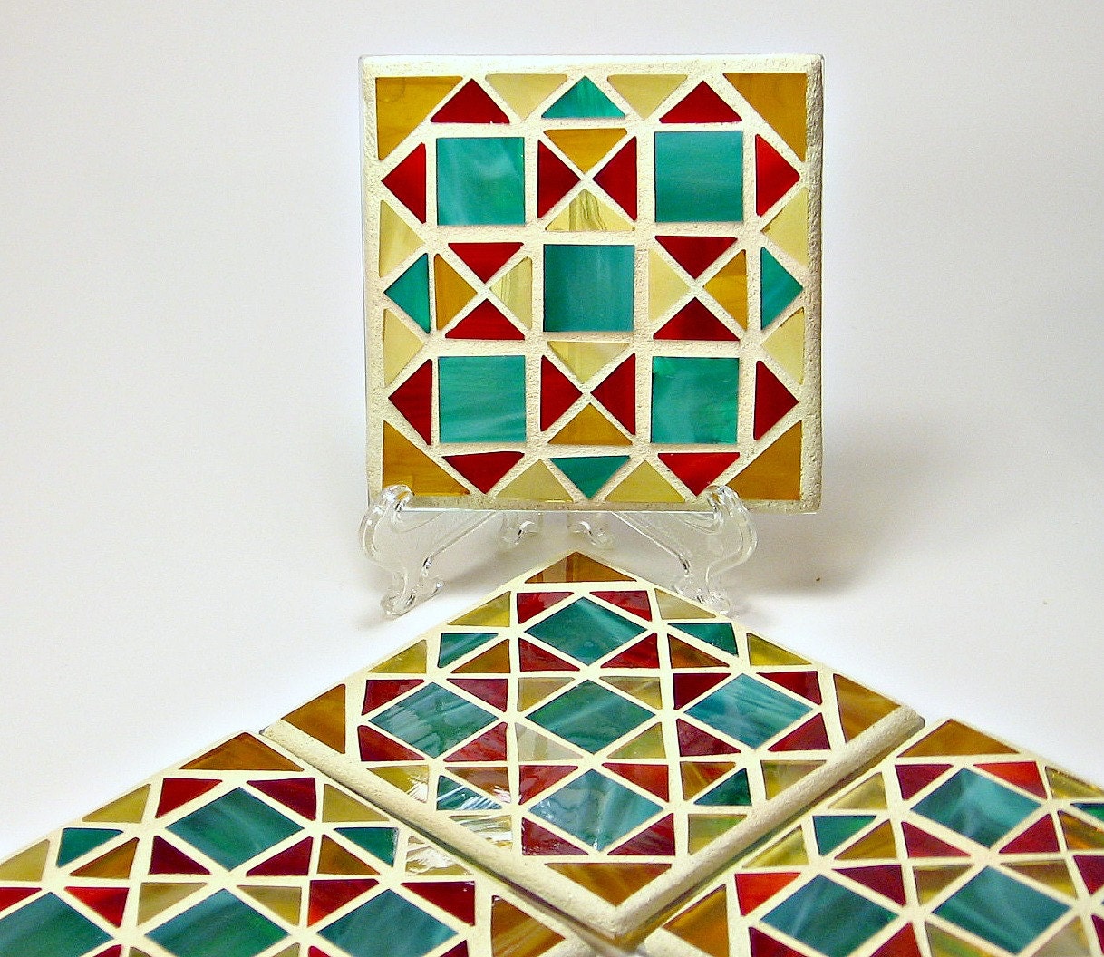 Stained glass mosaic coaster set red gold green and amber