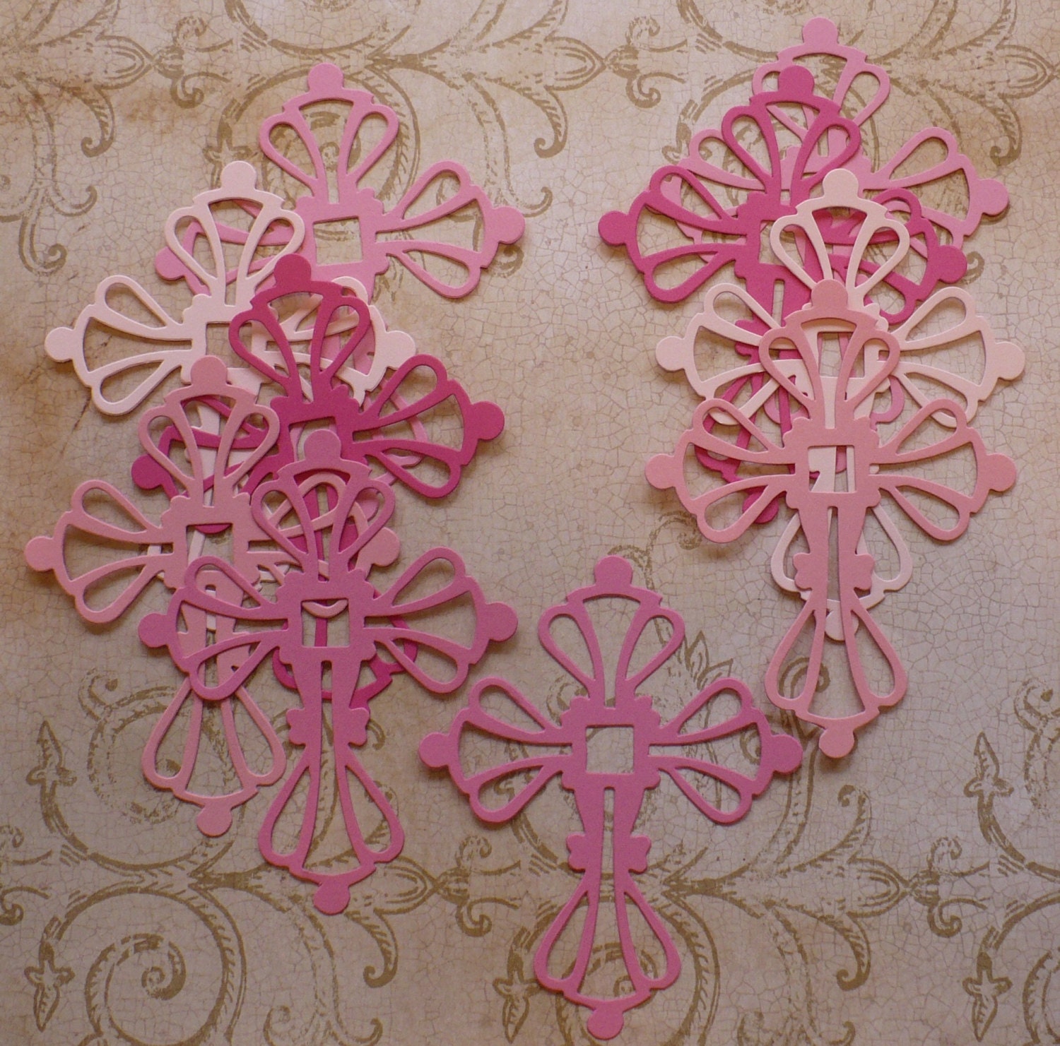 10 Scroll Cross Die Cut shape pieces made from Assorted Pink