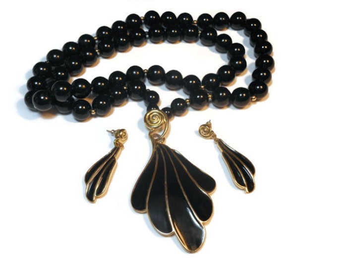 Black Trifari necklace and earrings modernist with gold accents, lucite pendant and earrings demi parure set with black lucite beads.