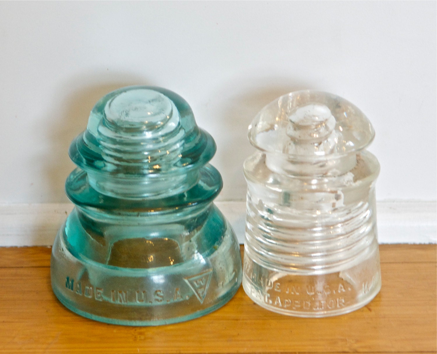 Two vintage electrical insulators teal and by 180degreesvintage