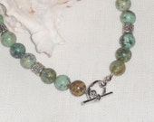 Speckled African green jade round beaded anklet; toggle clasp closure; jade jewelry