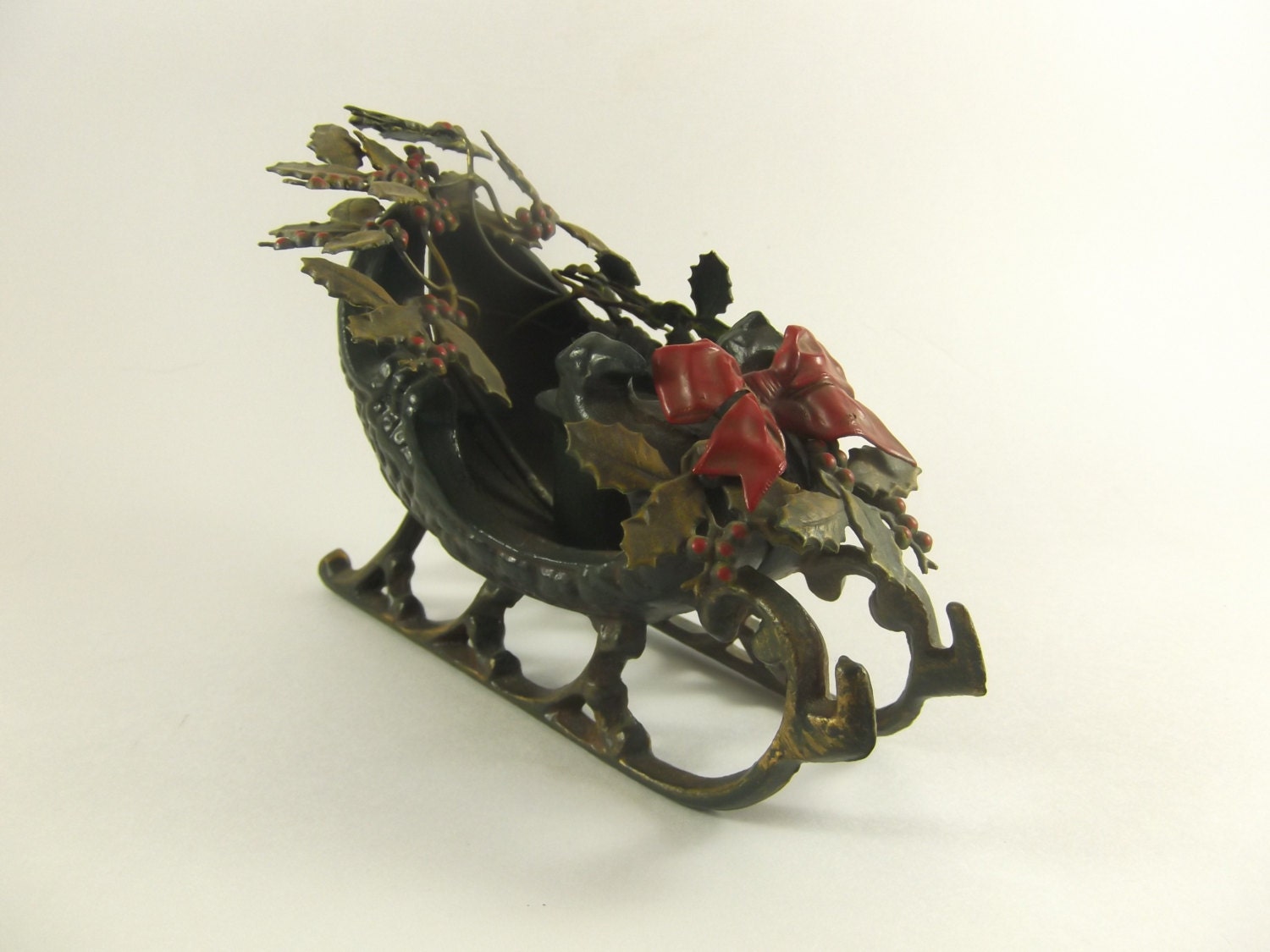cast iron sleigh christmas candle holder with holly and bow cast iron sleigh christmas candle holder with holly and bow