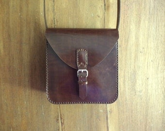 Leather bag. Crossbody bag. Medium size. Hand sewn. Dark brown. Bag with buckle.