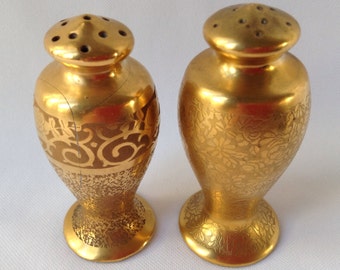 Gold mismatched salt and pepper shakers (repaired) (not perfect)