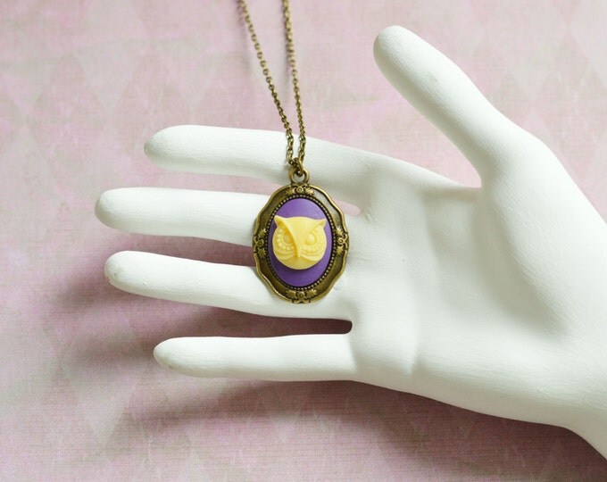 The wisdom of owls // Pendant made of metal brass, polymer clay cameo, Yellow owl on a purple background