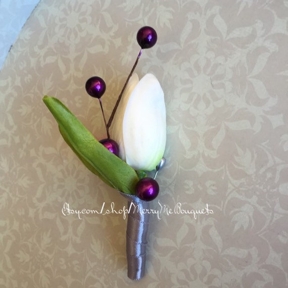 White tulip boutonniere with Purple. True touch tulip boutonniere