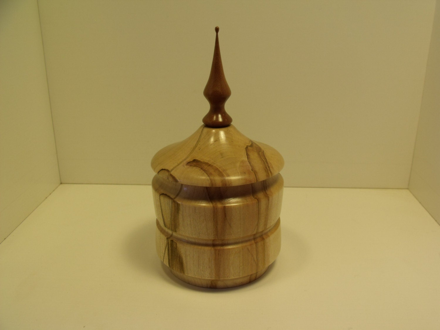 Decorative lathe turned wooden box.
