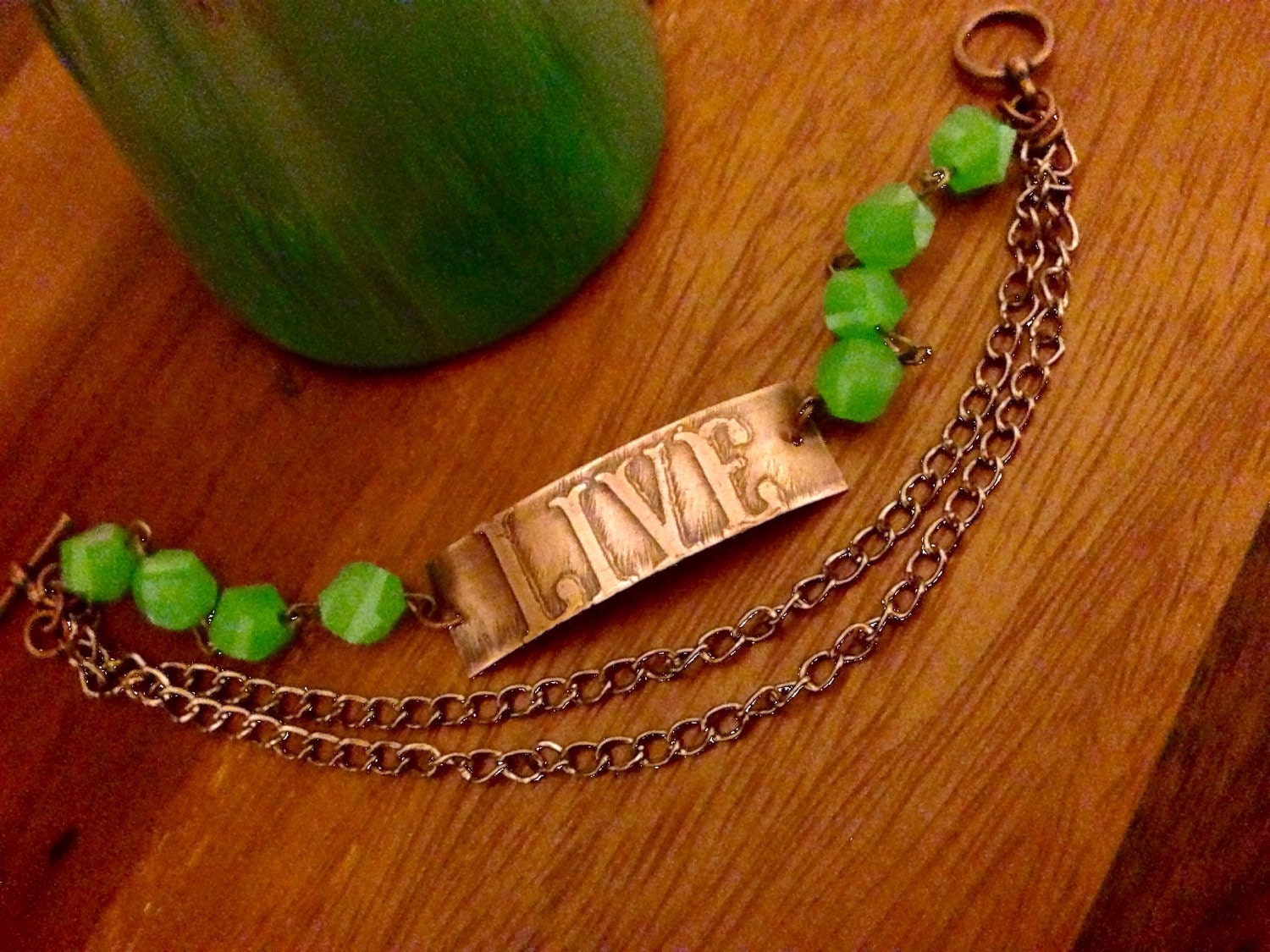 An inspirational life quote copper etched metal boho bracelet.