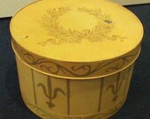 Large Metal Hat Box Golden Colored with Green Laurel Wreath Design on Lid Vintage..SALE... REDUCED to 25 Dollars Large Metal Hat Box Golden Colored with Green Laurel Wreath Design on Lid Vintage..SALE... REDUCED to 25 Dollars