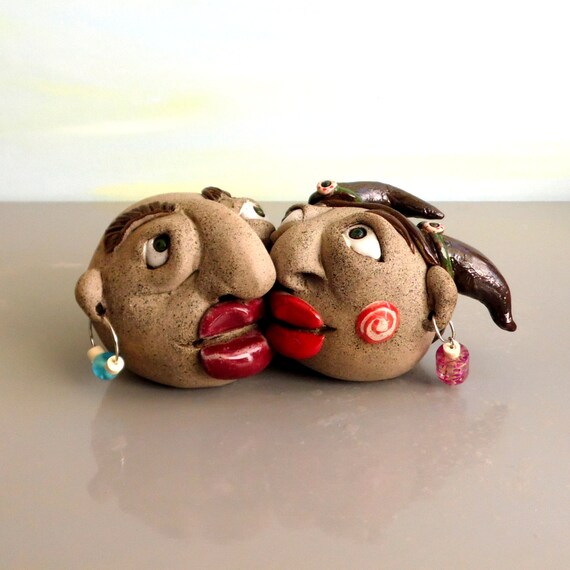 Ceramic sculpture of kissing couple heads lovers sculpture