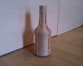 Bottle hand decorated with twine / bottle wrapped in twine