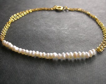 Tender arm bracelet with freshwater pearls