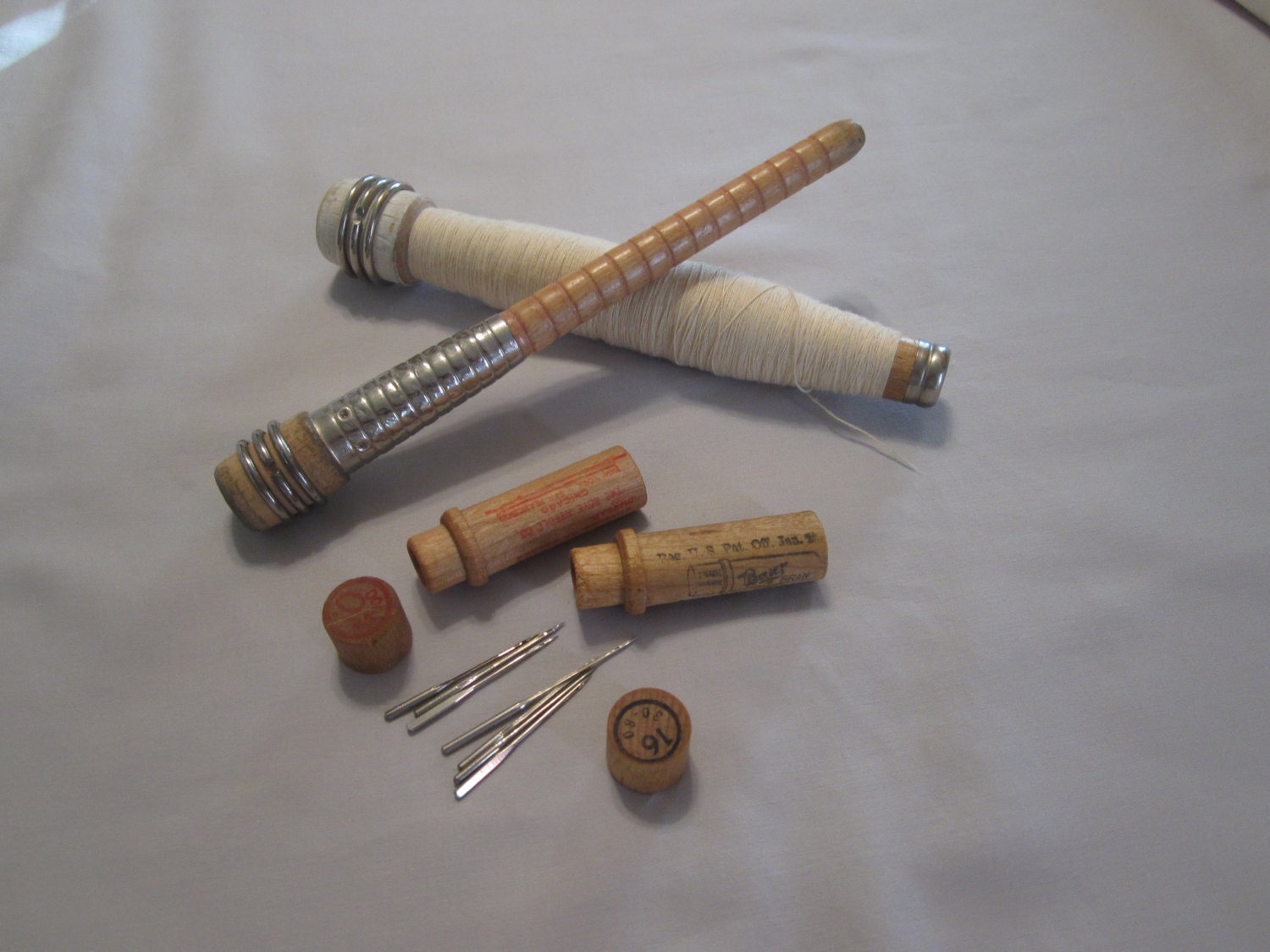 Antique sewing machine needles and spools by MTHiwayltd on Etsy