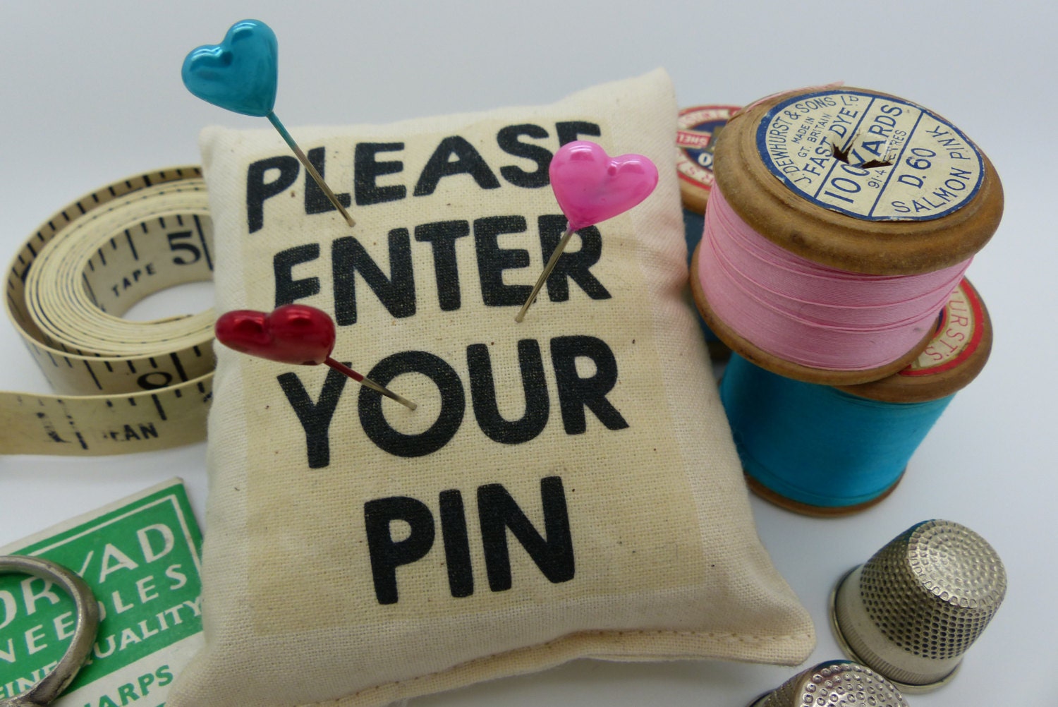 Pin cushion. Please enter your pin. Pins and needles.