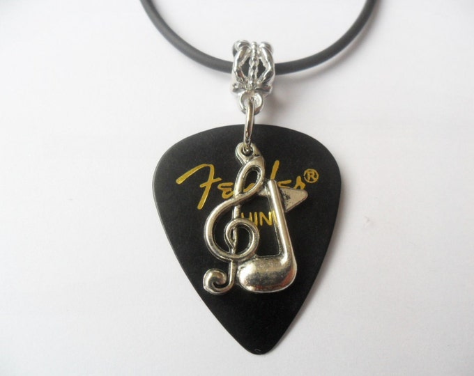 Guitar pick necklace,black, with treble clef music note charm that is adjustable from 18" to 20"