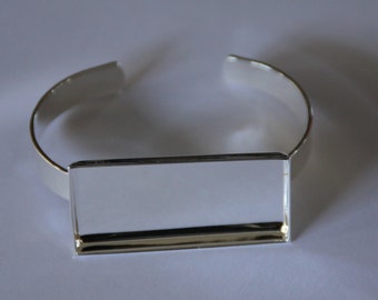 5 x Silver plated solid bangles with rectangle bezel tray