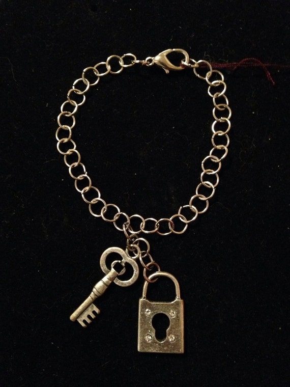 Items similar to Bracelet with lock and key charm on Etsy