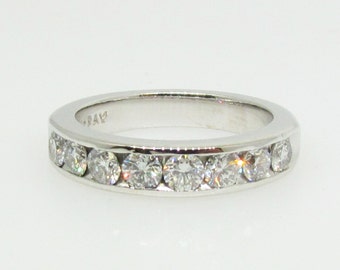 14 K white gold diamond wedding band.