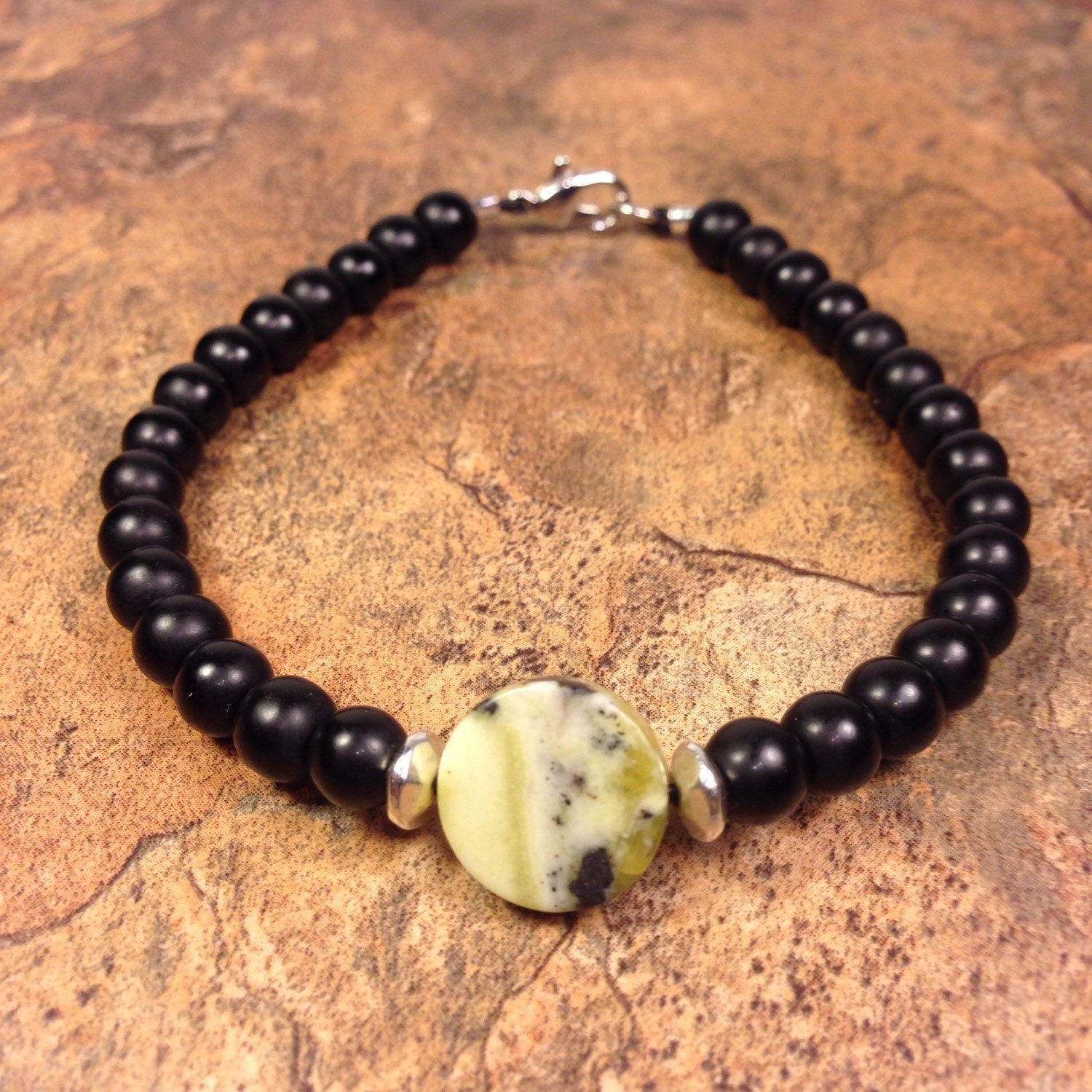 Serpentine stone bracelet with black glass beads beaded