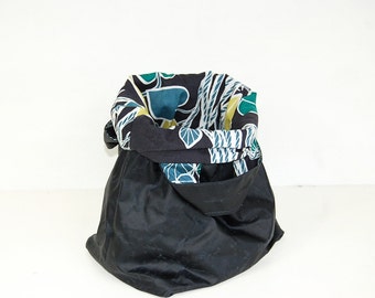 Storage basket in black wax canvas, lined with leaf pattern fabric from IKEA