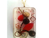 Resin Pendant necklace - red painted gum leaf, black & gold gum nuts, banksia stamen, metal pieces and pigment. Perfect for Valentine's Day