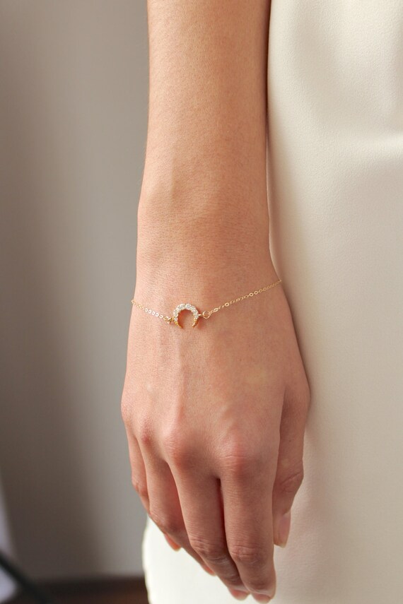 Gold crescent moon bracelet (model photo)