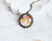 Wild Nature // Round pendant metal brass depicting a deer under glass // Greenpeace // Animals // Rustic, Vintage // Brown, Soft, Beige