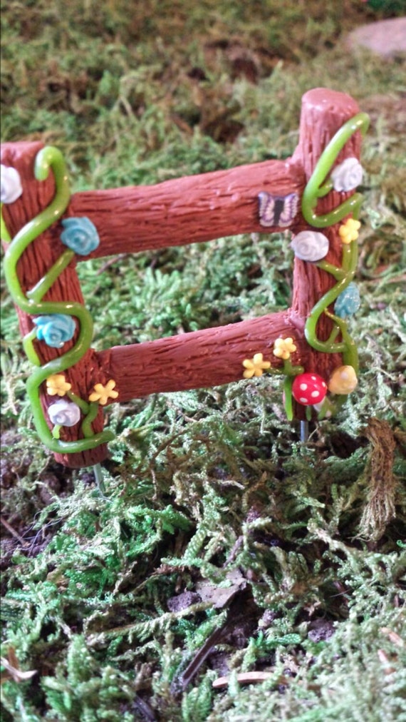 Miniature fence for fairy garden or dollhouse. Vines
