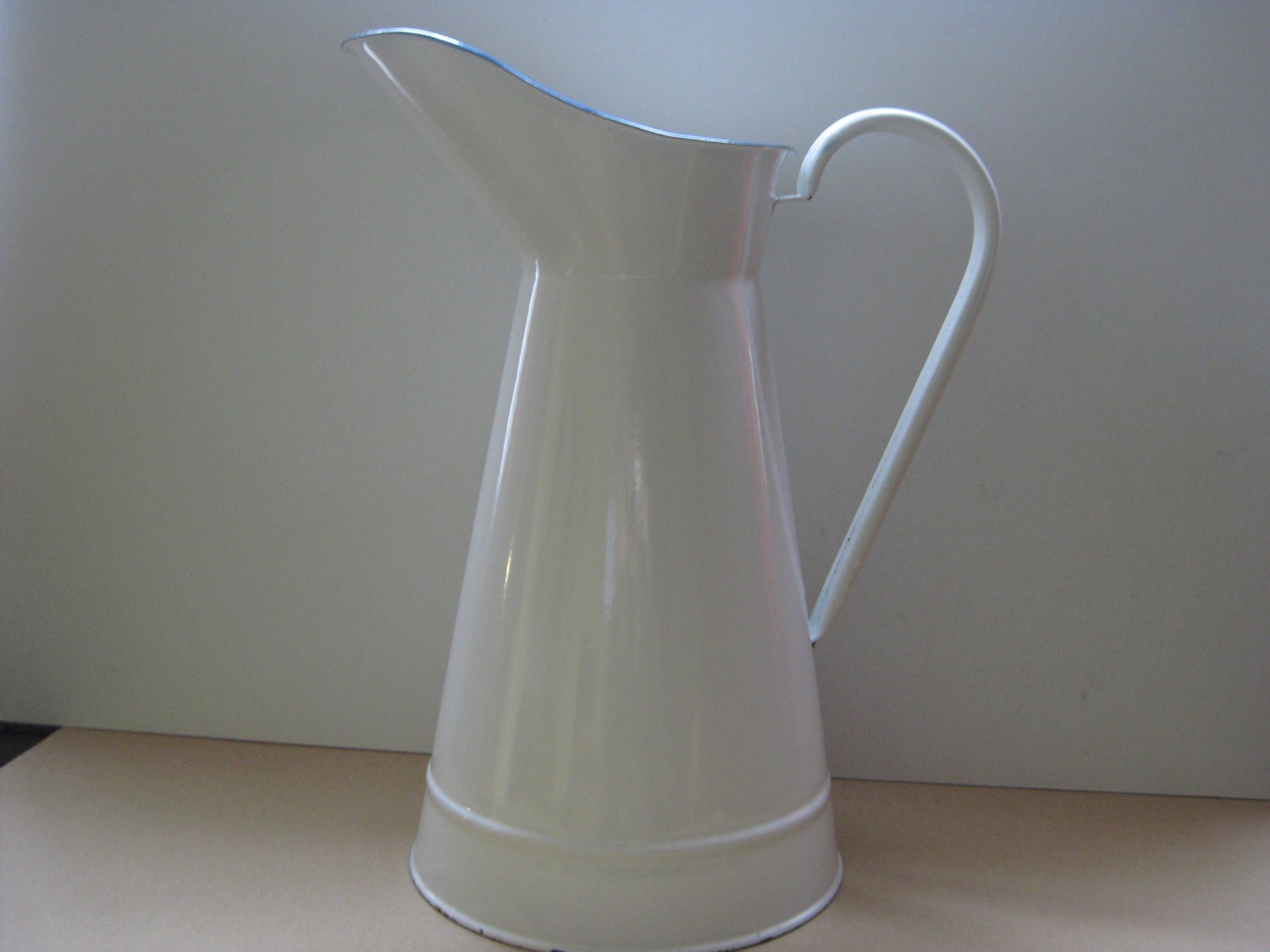 Vintage French white enamel water pitcher.