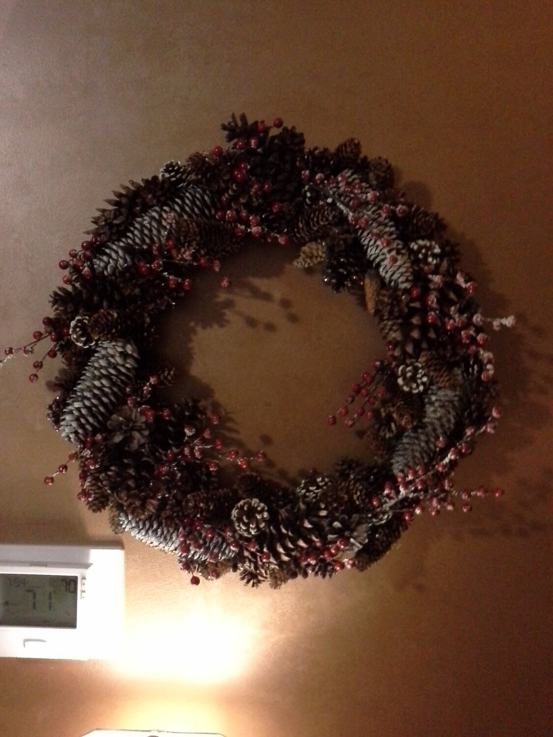 Pinecone wreath with red berries